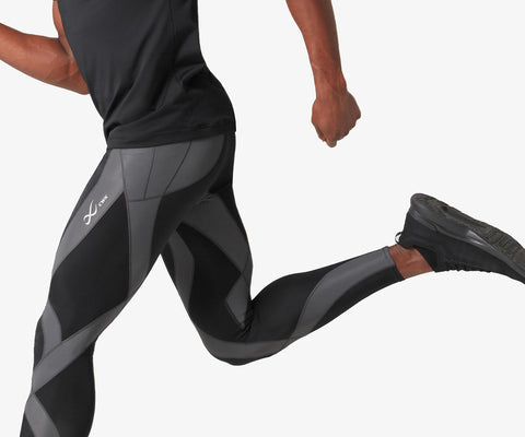 male athlete running in endurance generator tights in black/dark grey